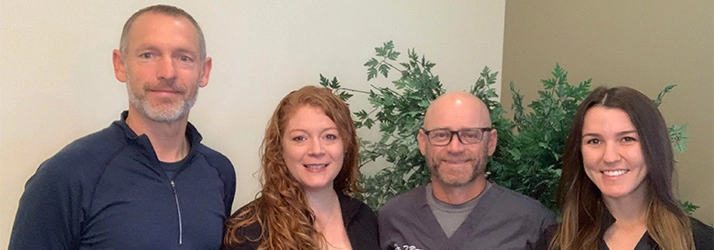 Chiropractor Iowa City IA Ryan Bowman & Christine Bowman With Team Chiropractor Iowa City IA Ryan Bowman & Christine Bowman With Team