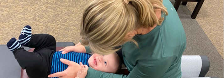 Chiropractor Iowa City IA Christine Bowman Adjusting Baby